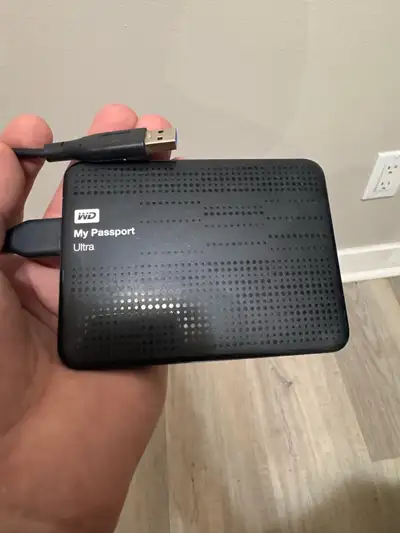 This WD My Passport Ultra 1TB portable external hard drive delivers reliable storage in a compact de...