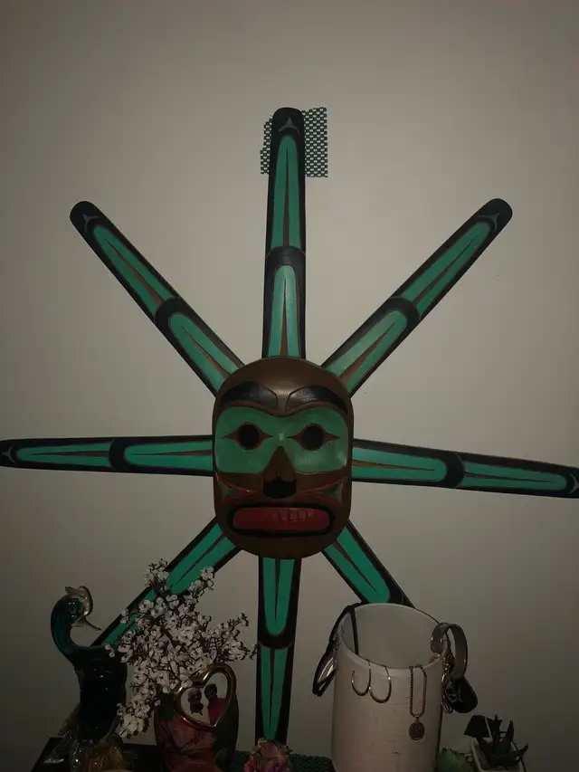 Native art carving of a sun mask 628632583121951212