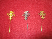 Rare vintage Olympic pins in gold, silver, bronze