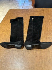 Woman’s soft black suede boots