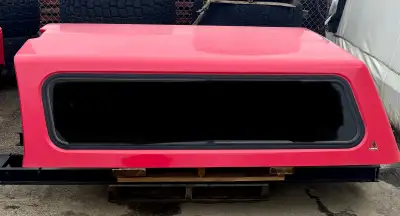 Wrapped in 3m red from new, white in color underneath the wrap. Sliding side and back of cab window....