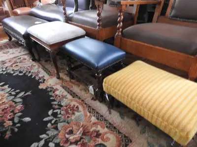 This is the second of two kijiji ads featuring a variety of antique fabric and leather footstools an...