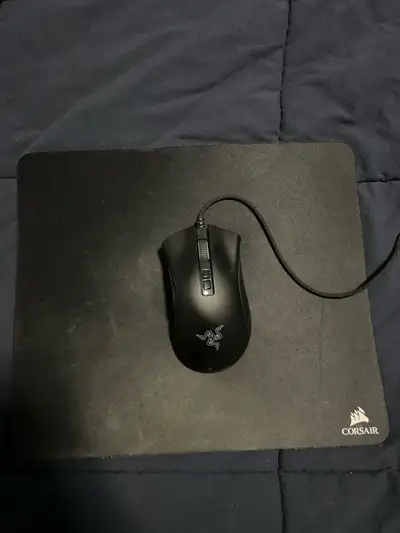Almost brand new Razer Deathadder v2 gaming mouse with a black corsair mouse pad. Asking 30. Pickup...
