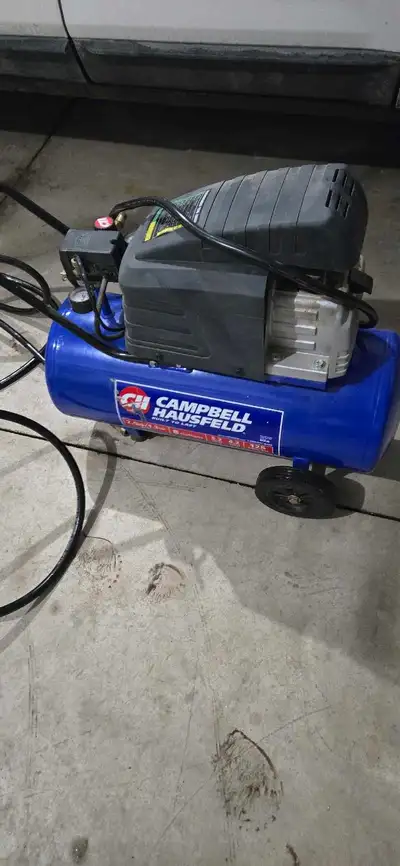 I'm selling a Campbell Hausfeld air compressor, a reliable tool for various inflation and power jobs...