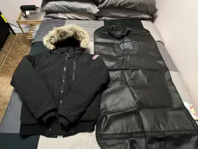 I'm selling a used Canada Goose Borden Bomber Jacket, a stylish and warm choice for facing the Canad...