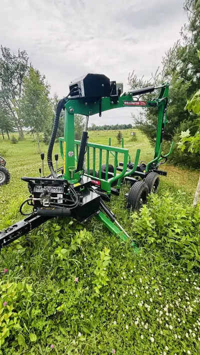 2022 Wallenstein wood hauler trailer. honda 9.9 hp motor and 100' winch. can to be towed on road beh...