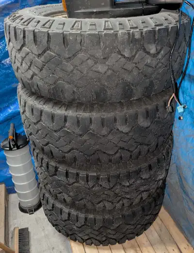 Set of 4 Chevy Truck Wheels with 17" Duratrack Tires. With center caps, need a good cleaning. 2 tire...