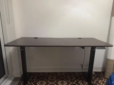 Selling a large office desk in great condition. Features an adjustable height motor, so you can easi...