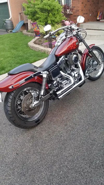 2002 Harley custom Wide Glide. 27xxx kms with new rubber and new battery last season. Bikes in great...