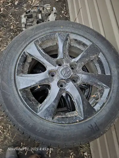 Selling a set of used Mazda rims and tires with a 205/55R16 91H specification, suitable for various...