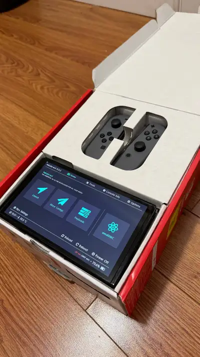 Nintendo Switch OLED with 10 games + modchip + original box, View more