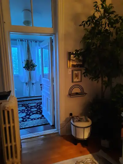 2 bedroom apartment plus enclosed sun porch. Centrally located, hardwood floors, laundry in building...