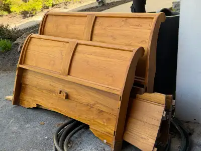 This is a used queen-sized teak bed frame, known for its durability and rich colour. This bed frame...