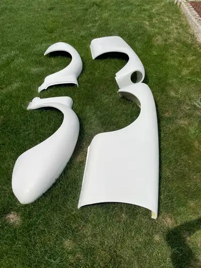 MGA fiberglass fenders. Made in England. After purchasing these, decided to rework the steel ones in...