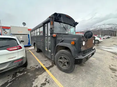 Converted bus many new parts king pins brake lines steering tires bed wood stove for heating and coo...
