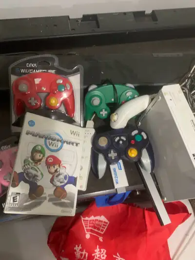 Nintendo Wii, mario kart, and  6 controllers, View more