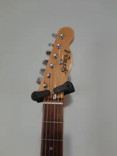 Series A . 2 single coil {8k ] master volume and tone... very nice telecaster style neck. / body...c...