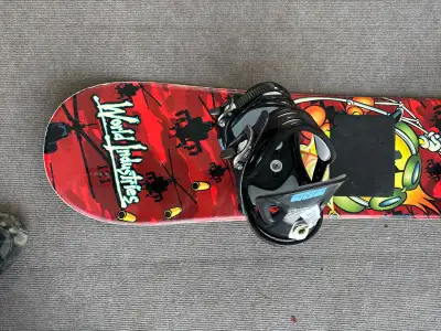 World Industries 121cm snowboard with Morrow bindings. Great intermediate board for kids.