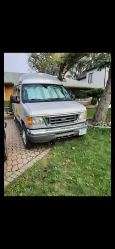 2007 Ford E350 XLT Silver Showroom Condition. Selling AS IS. Make an Offer!!!!! Comes with Fridge, s...