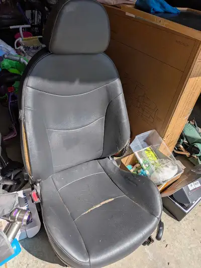 Driver seat from 2005 mini cooper. Leather is separated in a few spots. Works well. Could also be us...