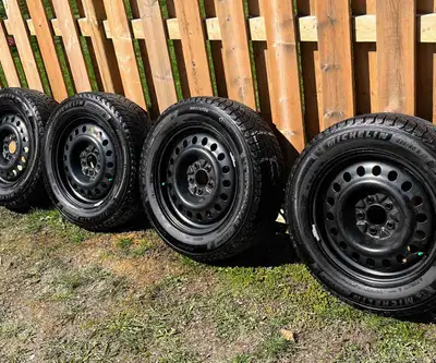 MUST SELL. Set of four 17 inch, 225/60R17 dedicated winter Michelin X-Ice snow tires with black stee...