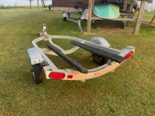 SINGLE WATERCRAFT TRAILER ...BOUGHT BRAND NEW. It was just serviced with new shackles and bolts. Sho...