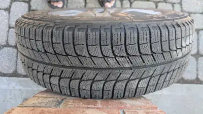4 Michelin X-Ice 215/60R16 winter tires mounted on Alloy rims. Good amount of tread left. I had them...
