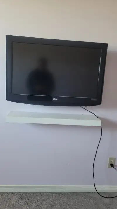 LG 32 " flat screen tv with remote and stand. It works perfectly, I'm just downsizing. Pick up only,...