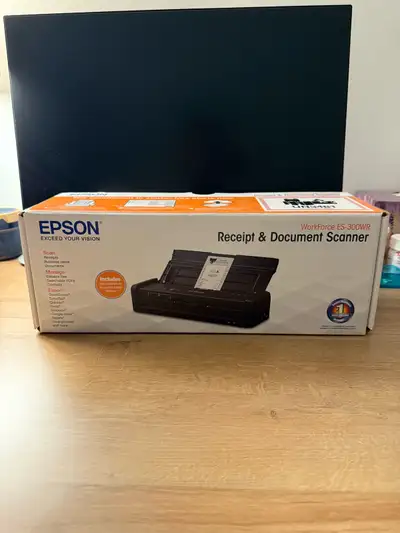 This is an open box. No defects No damages Here I have an Epson WorkForce ES-300WR, a wireless porta...