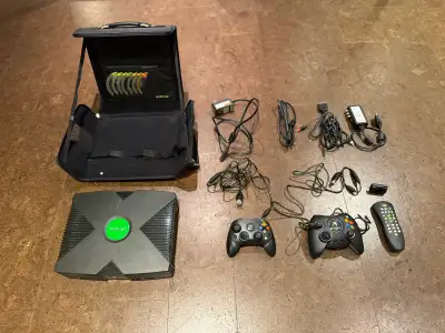 Step back into the golden age of gaming with this vintage Microsoft Original Xbox console, which has...
