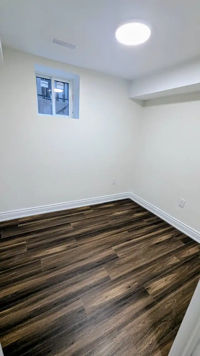 NEWLY RENOVATED 2-BEDROOM DEN BASEMENT APARTMENT