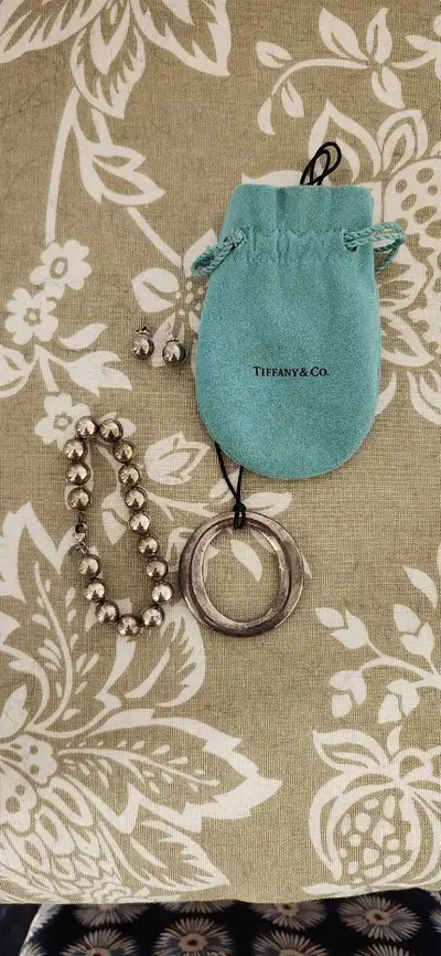 Selling a beautiful Tiffany & Co. Sterling silver jewellery set, including a ball bracelet, ring pen...