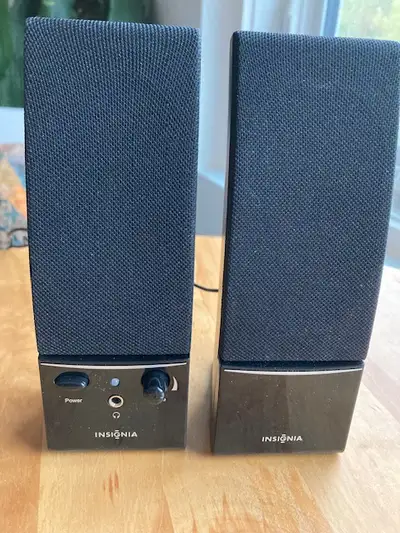 A set of Insignia Speakers with a power cord. like new - great for laptop note: the speakers are act...