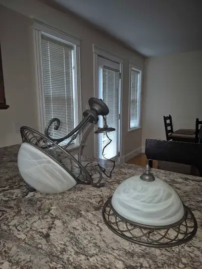 Metal and frosted glass chandelier as well as matching ceiling light