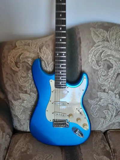 Fender Build, fender body. aftermarket neck, alnico 5 pickups, locking tuners. Plays great (low acti...