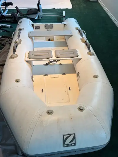 Zodiac XL 320 RIB for sale equipped with a Mariner 15 hp outboard made by Yamaha. This is a hard bot...