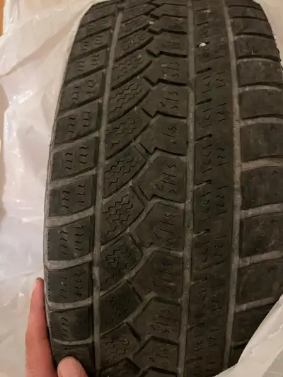 Winter tires with rims on. In fair condition