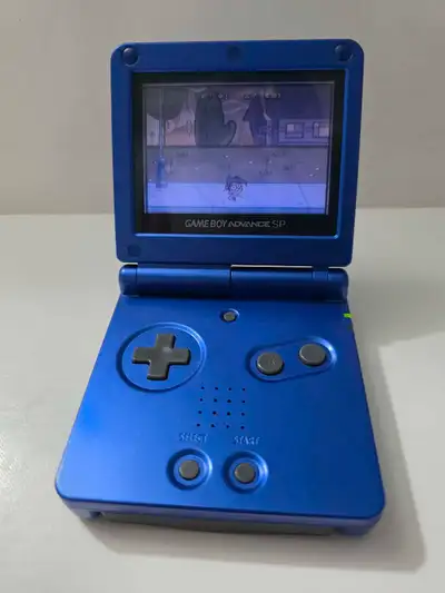 Gameboy Advance SP model AGS 001 Screen is excellent shape body has some surface scratches! Console...