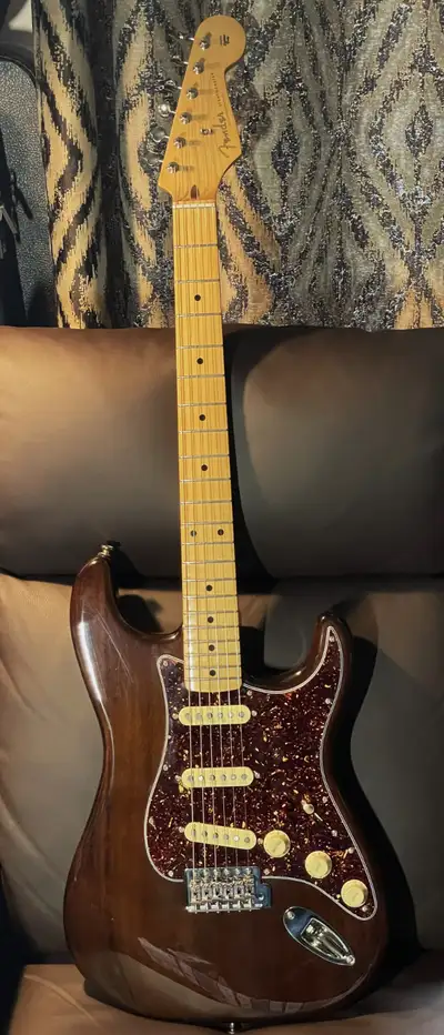 A new MIM Strat in gloss Walnut finish, Vintera Maple "Soft V" 7.25" radius, 21 fret neck with vinta...