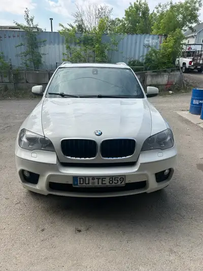 2012 BMW M package. Engine light is on. Runs, but idles rough. Has hail damage. Back panel of sunroo...