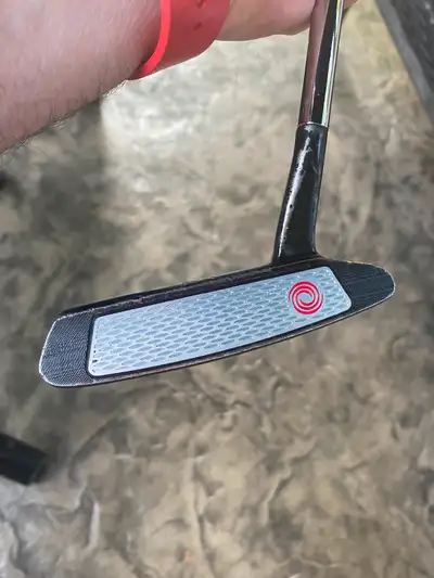 Odyssey metal x6 putter with large Winn putter grip (grip like new). 33 inch, you may think it is to...