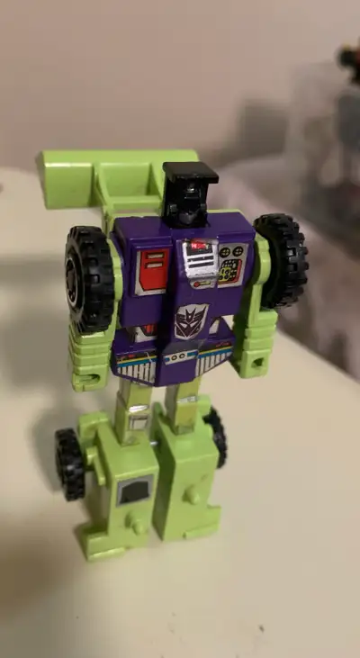 Relive your childhood with this G1 Scrapper Transformer, a must-have for any serious collector! This...