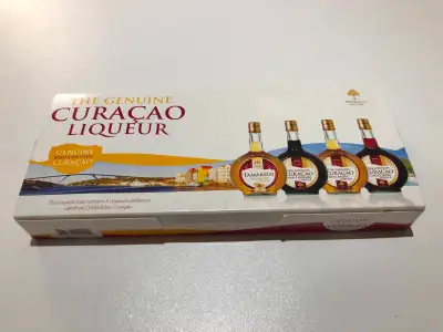 Genuine Souvenir gift box from Curacao, distilled at Landhuis Chobolobo Curacao four 50ml mini bottl...