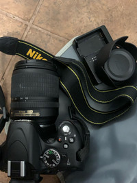 Nikon digital camera D5100 with lense