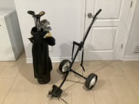 Golf clubs and golf push cart.