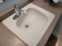 White Porcelain Bathroom Sink and Faucet