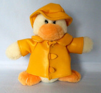 Friendly plush stuffed duck with yellow seaman raincoat