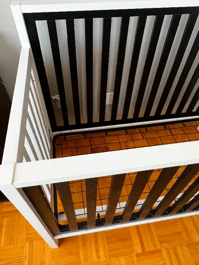 A used wooden crib with an acceptable condition with some minor scratches on it but made of a good q...