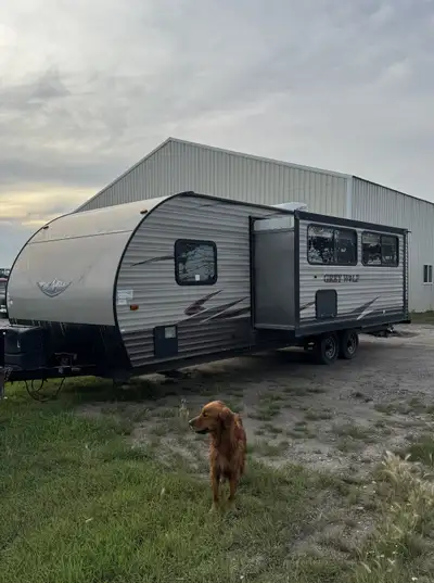 2017 Forest River Grey Wolf 26DBH bumper pull travel trailer with bunks and large slide out. Large u...