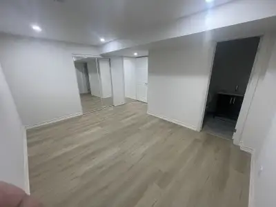 This spacious apartment features a modern kitchen equipped with stainless steel appliances including...